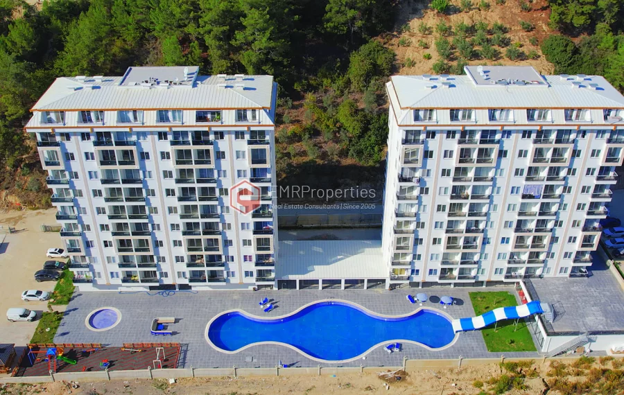 Brand new 1+1 apartment for sale in a luxury complex intertwined with nature