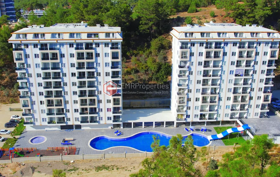 Brand new 1+1 apartment for sale in a luxury complex intertwined with nature
