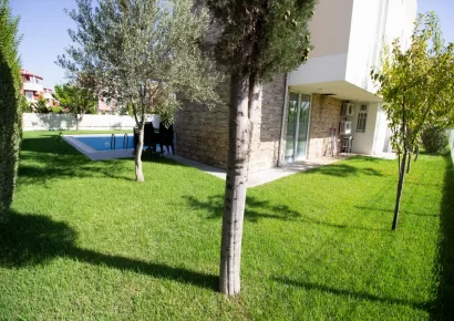 Detached 4-bedroom triplex villa for sale in the golf center in Belek