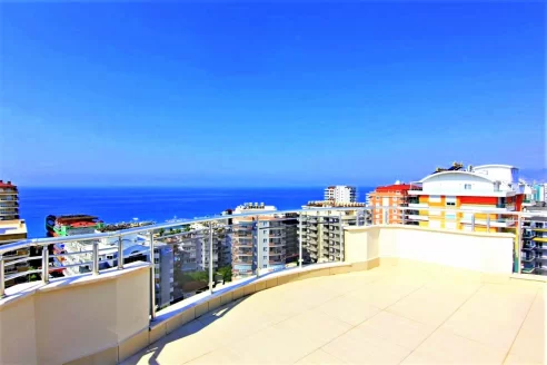 Роскошный 4-спальный пентхаус с огромной террасой и панорамным видом на продажу в Махмутларе