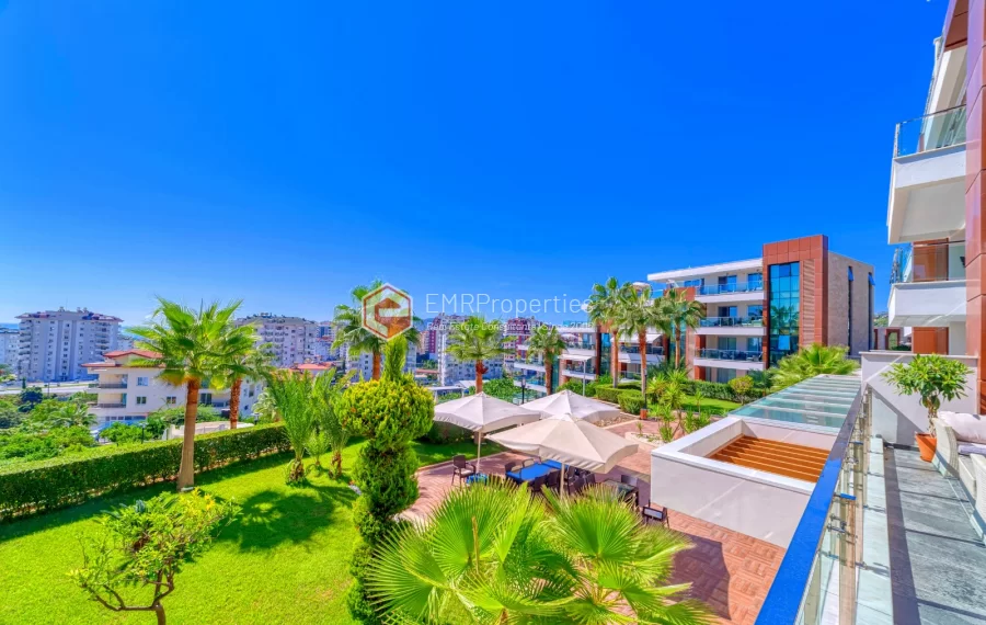 Просторная 4-х спальная квартира с видом на море на продажу в Джикджилли Аланья