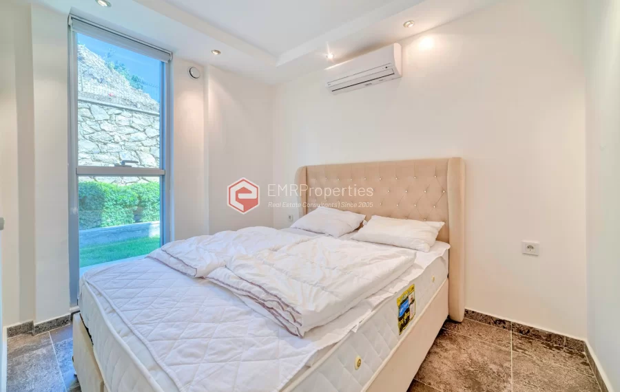 Просторная 4-х спальная квартира с видом на море на продажу в Джикджилли Аланья