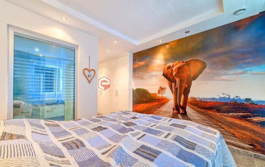 Просторная 4-х спальная квартира с видом на море на продажу в Джикджилли Аланья